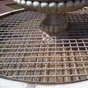 Steel grill in water fountain 